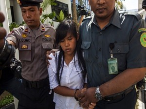 Philippine convicted drug smuggler on death row Mary Jane Fiesta Veloso, is escorted by Indonesian police as she arrives at the court in Sleman in central Java island for a hearing of judicial review on March 3, 2015 after a plea for clemency was rejected by Indonesian President Joko Widodo. A Frenchman, two Australians, Brazilian and a Filipino are among a group of foreigners, who have lost their appeals for clemency and are facing imminent execution. Brazil and France have also been ramping up pressure on Jakarta, with Paris summoning Indonesia's envoy and the Brazilian president refusing to accept the credentials of the new Indonesian ambassador. AFP PHOTO / SURYO WIBOWO