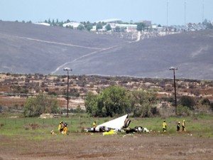 Authorities say multiple people died following the midair collision and crash of two small planes near an airport in southern San Diego County. Federal Aviation Administration spokesman Ian Gregor says the collision occurred around 11 a.m. Sunday, Aug. 16, 2015, about 2 miles northeast of Brown Field Municipal Airport. (John Gastaldo/U-T San Diego via AP)