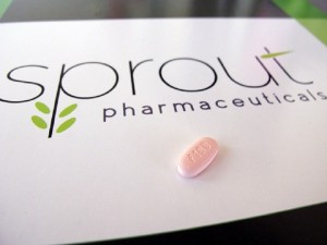 In this June 22, 2015, photo, a tablet of flibanserin sits on a brochure for Sprout Pharmaceuticals in the company's Raleigh, N.C., headquarters. Sprout soon may succeed where many of the worlds largest pharmaceutical companies have failed: in winning Food and Drug Administration approval for flibanserin, dubbed Addyi, the first drug to boost womens sexual desire. (AP Photo/Allen G. Breed)