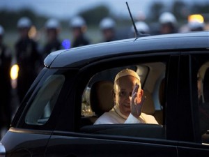 Pope Francis waves from his Fiat as he prepares to depart for Rome at Philadelphia International Airport in Philadelphia on Sunday, Sept. 27, 2015. (AP Photo/Laurence Kesterson)