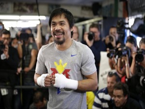 Manny Pacquiao, of the Philippines, smiles during a workout Wednesday, April 15, 2015, in Los Angeles. Pacquiao is scheduled to fight Floyd Mayweather Jr. in a welterweight boxing match in Las Vegas on May 2. (AP Photo/Jae C. Hong)