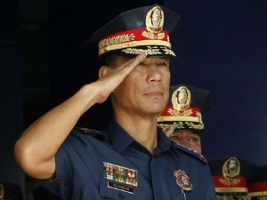 On the first day on the job, newly-installed PNP chief P/Dir. Gen. Ricardo Marquez salutes as he leads the weekly flag raising ceremony at Camp Crame in Quezon City on Monday, July 20. Marquez succeeded retired P/Gen. Leonardo Espina, who formally stepped down on July 16. (Mark Balmores)