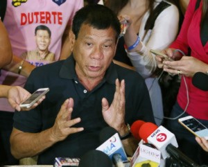 FILE - In this April 29, 2016, file photo, Presidential candidate Rodrigo Duterte answers questions from the media in Manila, Philippines. The upcoming Philippine presidential election could cause some heartburn in Washington. The winner of the vote on May 9 will be hand-maiden to the most crucial U.S. relationship in Southeast Asia, and front-runner Duterte has not inspired confidence with his casual threats to shoot criminals and by joking about the gang rape and killing of a foreign missionary. (AP Photo/Bullit Marquez, File)