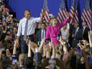 President Barack Obama and Democratic presidential candidate Hillary Clinton wave to the crowd during a campaign rally for Clinton in Charlotte, N.C., Tuesday, July 5, 2016. (AP Photo/Chuck Burton)