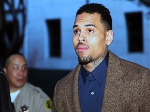 FILE - In this Feb. 3, 2014 file photo, R&B singer Chris Brown arrives at a Los Angeles Superior Court for a probation review hearing in Los Angeles. A judge ordered Chris Brown on Friday, Feb. 28, 2014, in Los Angeles, to remain in an anger management rehab program and told the pop singer to return to court in two months. Superior Court Judge James Brandlin scheduled the next hearing in Browns case for April 23, 2014.  (AP Photo/Nick Ut, file)