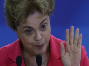 Brazil's President Dilma Rousseff speaks during a Women in Defense of Democracy Meeting, at the Planalto Presidential Palace, in Brasilia, Brazil, Thursday, April 7, 2016. The women representing social movements and trade unions, and are against Rousseff's removal from office, gathered to show her their support. The special investigator for a congressional commission recommended Wednesday that the impeachment process against Rousseff move forward, saying there is evidence she violated fiscal laws. (AP Photo/Eraldo Peres)