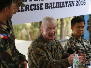 Lt. Gen. John Toolan, center, Commander of US Marine Corps in the Pacific, gestures while answering questions following the 11-day joint US-Philippines military exercise dubbed "Balikatan 2016" (Shoulder-To-Shoulder 2016) Thursday, April 14, 2016 at Crow Valley, Tarlac province north of Manila, Philippines. U.S. Defense Secretary Ash Carter arrived in the country Wednesday for talks with President Benigno Aquino III and other top defense and military officials and to visit two military camps being utilized for the exercise. Looking at right is Philippine Vice-Admiral Alexander Lopez.(AP Photo/Bullit Marquez)