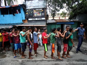 OPLAN TOKHANG / OCTOBER 06, 2016 Alleged drug suspects line up during Operation Tokhang on a impoverished community in San Miguel, Binondo, Manila.Three were reported killed on the operation. INQUIRER PHOTO / RICHARD A. REYES