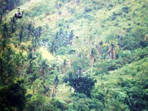 Huey-chopper-dropping-leaflets-over-Davao-Oriental-Feb-2017-300x200