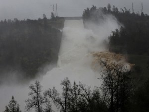 Water rushes down the Oroville Dam spillway, Thursday, Feb. 9, 2017, in Oroville, Calif. State engineers on Thursday discovered new damage to the Oroville Dam spillway, the tallest in the United States, though they said there is no harm to the nearby dam and no danger to the public. Earlier this week, chunks of concrete went flying off the spillway, creating a 200-foot-long, 30-foot deep hole. (AP Photo/Rich Pedroncelli)