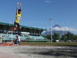 LONG JUMP / APRIL 11, 2016 John Marvin Rafols (215), Central Visayas Athletic Association, wins gold at long jump during the Palarong Pambansa 2016 competition at Bicol University Sports Complex, Legazpi City in Albay province, April 11, 2016. At the background the Mayon Volcano. INQUIRER PHOTO / NINO JESUS ORBETA