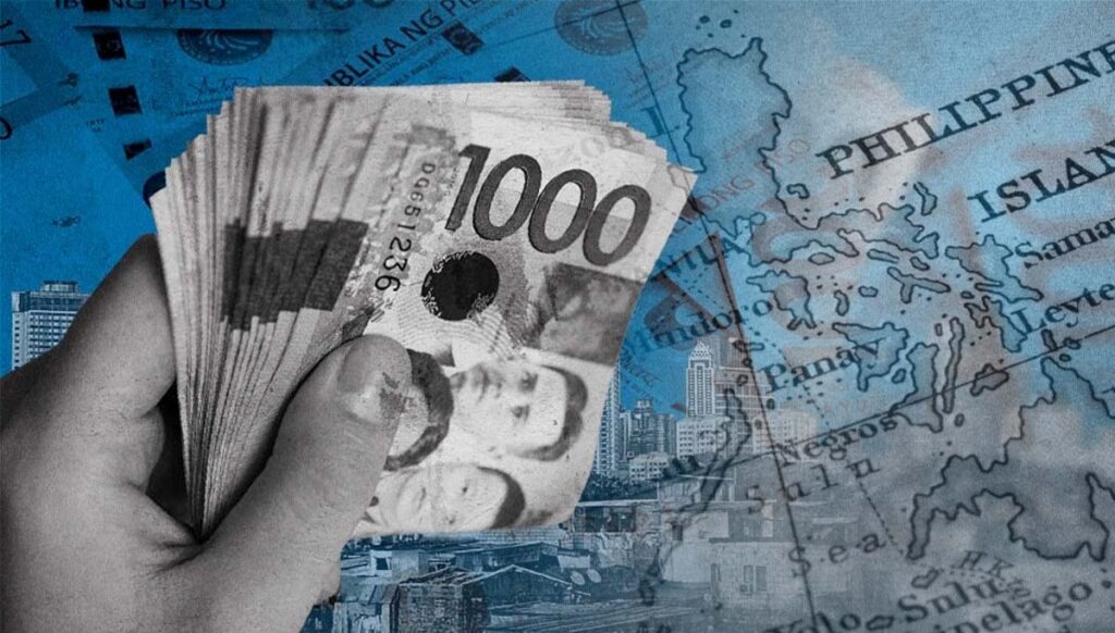 PHOTO: Composite image of hand holding 1,000-peso bills over map of the Philippines STORY: Ekonomiya ng Pilipinas lumago ng 5.7% Q1 ng taong ito – PSA