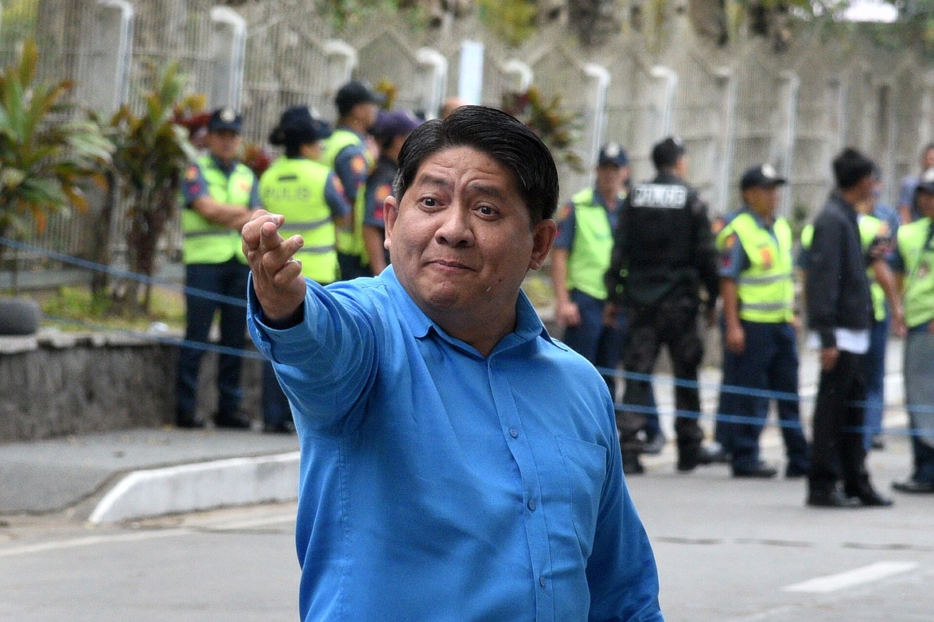 PHOTO: Lawyer Larry Gadon flashes a dirty finger at the crowd outside the summer courthouse of the Supreme Court. STORY: Gadon: A walking, talking liability – INQUIRER EDITORIAL