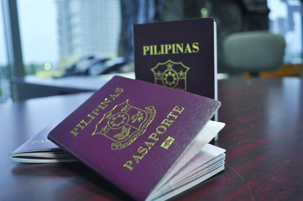 PHOTO: Philippine passports on a table STORY: 28M PH passports bukas sa cyber criminals dahil sa data breach